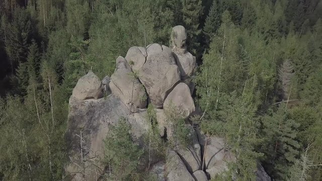 Aerial view stone rocks Ternoshorska Lada amidst beautiful scenic Carpathian mountains and forest. Symbol of motherhood and fertility, Kosiv Region, Ivano-Frankivsk Oblast, Ukraine