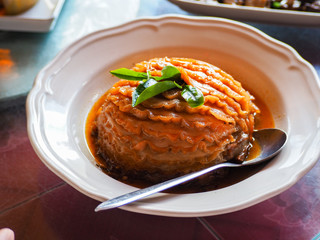 Thai street food of grilled pork sausage, chicken and rice.