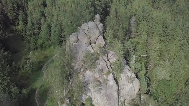Aerial view stone rocks Ternoshorska Lada amidst beautiful scenic Carpathian mountains and forest. Symbol of motherhood and fertility, Kosiv Region, Ivano-Frankivsk Oblast, Ukraine