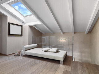 interior shot of a modern living room in the attic, in the foreground the fabric chaise-lounge the floor is made of wood