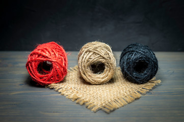 Three balls of natural hemp or sisal twine