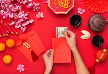 Woman preparing dollars for present on Chinese New Year