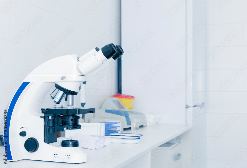 Poster close up of high quality microscope on table