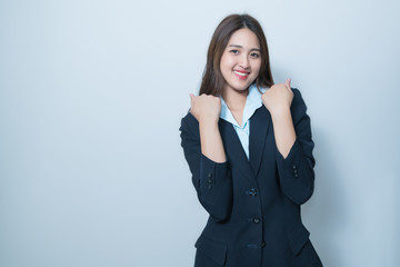 Business woman celebrate something with arms up