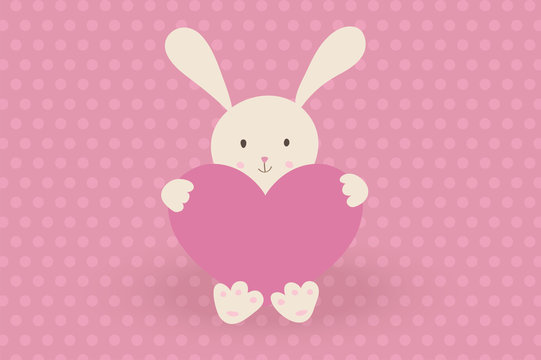 Cute vector illustration. Little toy rabbit with heart on pink background with polka dot.