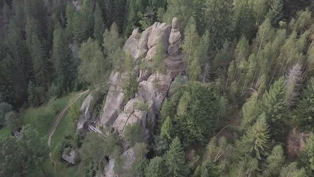 Aerial view stone rocks Ternoshorska Lada amidst beautiful scenic Carpathian mountains and forest. Symbol of motherhood and fertility, Kosiv Region, Ivano-Frankivsk Oblast, Ukraine
