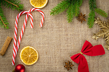 Christmas Background Red. Xmas celebration decoration isolated on linen texture. New Year pattern. Flat lay design.Copy Space