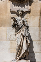 Statue at the the Paris Opera House, Palais Garnier, in Paris, France is known for its opulent...