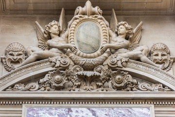 Fototapeta na wymiar Beautiful statue at the Paris Opera House, Palais Garnier, in Paris, France is known for its opulent Baroque style interior decor and Beaux-Arts exterior architecture.