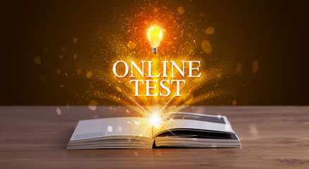 ONLINE TEST inscription coming out from an open book, educational concept