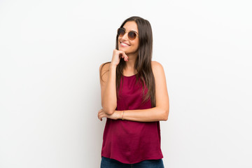 Young woman over isolated white background with glasses