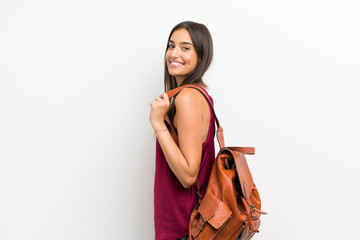 Young woman over isolated white background with backpack