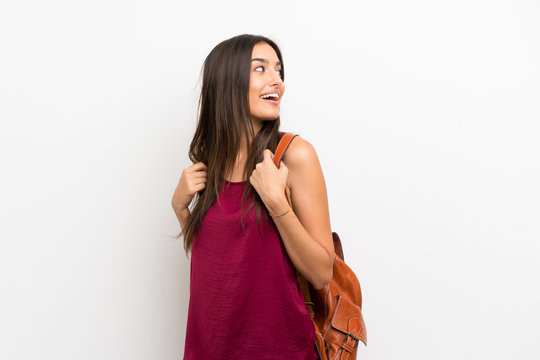 Young Woman Over Isolated White Background With Backpack