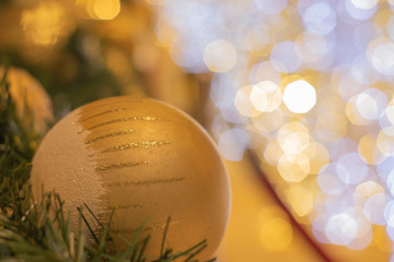 Golden balls to decorate the New Year's festival, the back is a hexagonal bokeh of lights to...