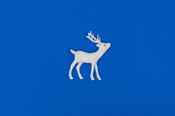 New Year and Christmas decorations. White deer. Top view, flat lay, copy space.