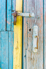 iron lock on wooden battered door of an old country house