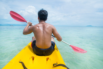 Adventure Man on a Sea Kayak is kayaking