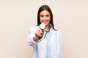 Young doctor woman over isolated background