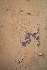 pink old painted wall with peeling paint