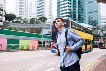 Student waiting for bus in modern city © GalakticDreamer