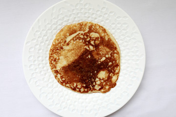 Pancake on white plate