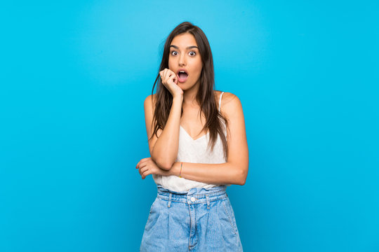 Young woman over isolated blue background feeling upset