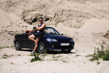 Fototapeta na wymiar auto business, transport, leisure and people concept - happy man near cabriolet car outdoors