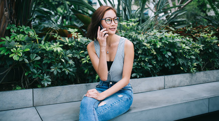 Asian female hipster talking on phone