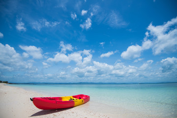 Fototapeta na wymiar Kayak on sand beach