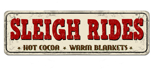 Sleigh rides vintage rusty metal sign