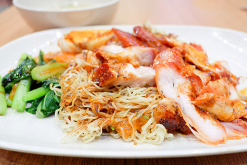 Wantan noodles, a Cantonese Chinese cuisine served dry with soy sauce and roast pork