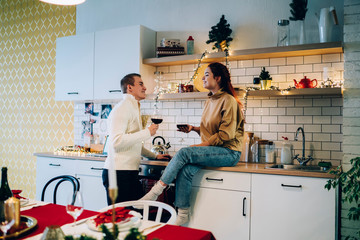Man and woman having wine on Christmas holidays