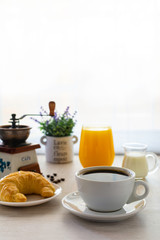 breakfast with coffee and croissant