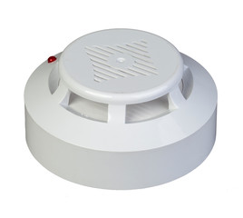 Modern smoke sensor hanging on ceiling. 