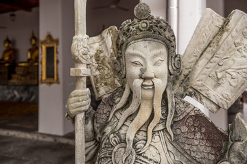 Chinese guardian figure beside a gate, Wat Pho, Bangkok, Thailand