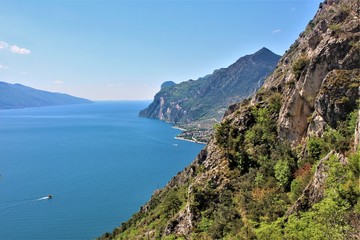 Fototapeta na wymiar View to Lake Garda. Hiking up to a mountain peak in Limone, Lago di Garda