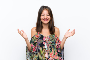 Caucasian young woman in colorful dress on isolated white background laughing