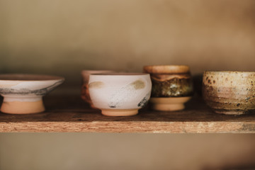 Clay pottery ceramic Products dry on shelf in workshop.