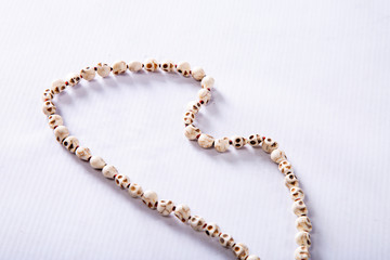 skull-shaped beads on a white background