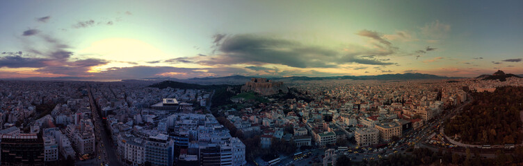 Fototapeta na wymiar Aerial drone photo of iconic Acropolis hill and the Parthenon at dusk with beautiful sky and colours, Athens, Attica, Greece