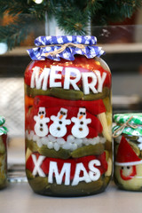 Funny jar of pickled vegetables in a hungarian christmas market as christmas present for sale