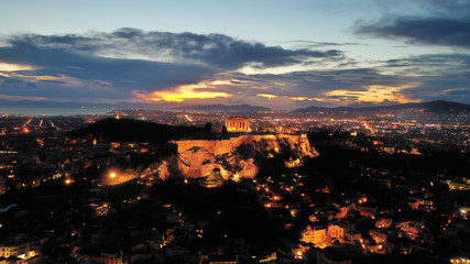 Fototapeta premium Aerial drone night shot of iconic Acropolis hill and the Parthenon at dusk with beautiful sky colours, Athens, Attica, Greece
