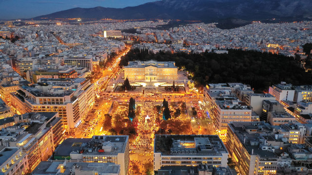 Aerial drone photo of illuminated festive Syntagma square featuring Greek Parliament and Christmas tree, Athens centre, Attica, Greece