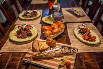 Appetizing smoked fish on kitchen board.Smoked mackerel.Smoked fish with spices