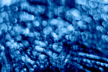 Blue bokeh. Glitter shiny sparkle abstract background. Color of the year 2020.