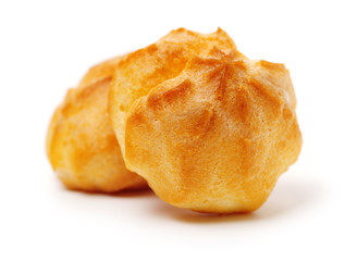 eclairs filled with fresh cream on white background
