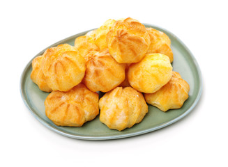 eclairs filled with fresh cream on white background