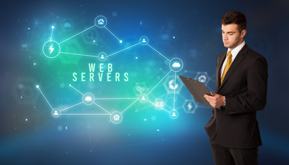 Businessman in front of cloud service icons with WEB SERVERS inscription, modern technology concept