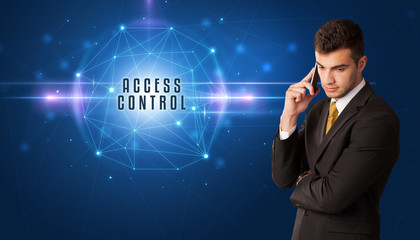 Businessman thinking about security solutions with ACCESS CONTROL inscription