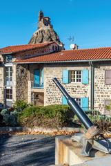 Saint Clair square in Aiguilhe commune, the famous Saint-Michel d Aiguilhe rock is at background....